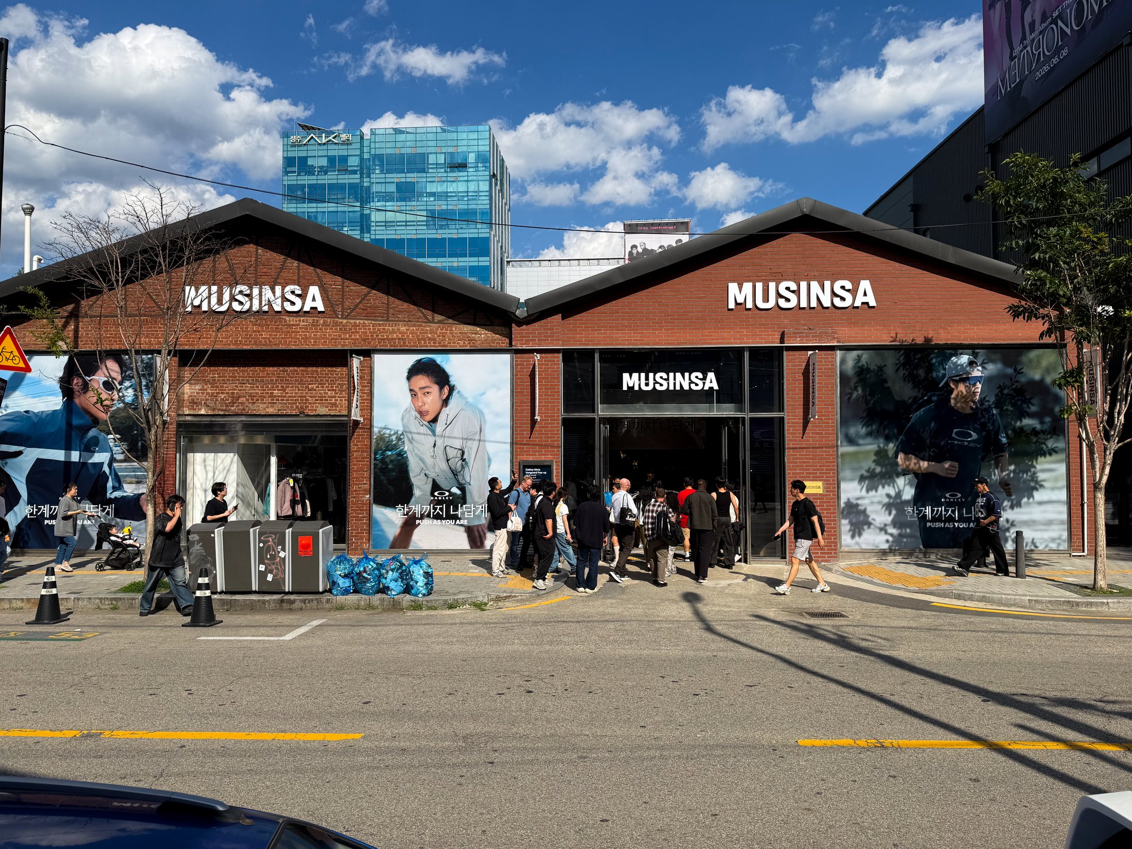 Oakley campaign visuals on the Musinsa storefront in Seoul